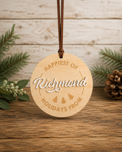 Round Happiest of Richmond holiday ornament in a winter setting